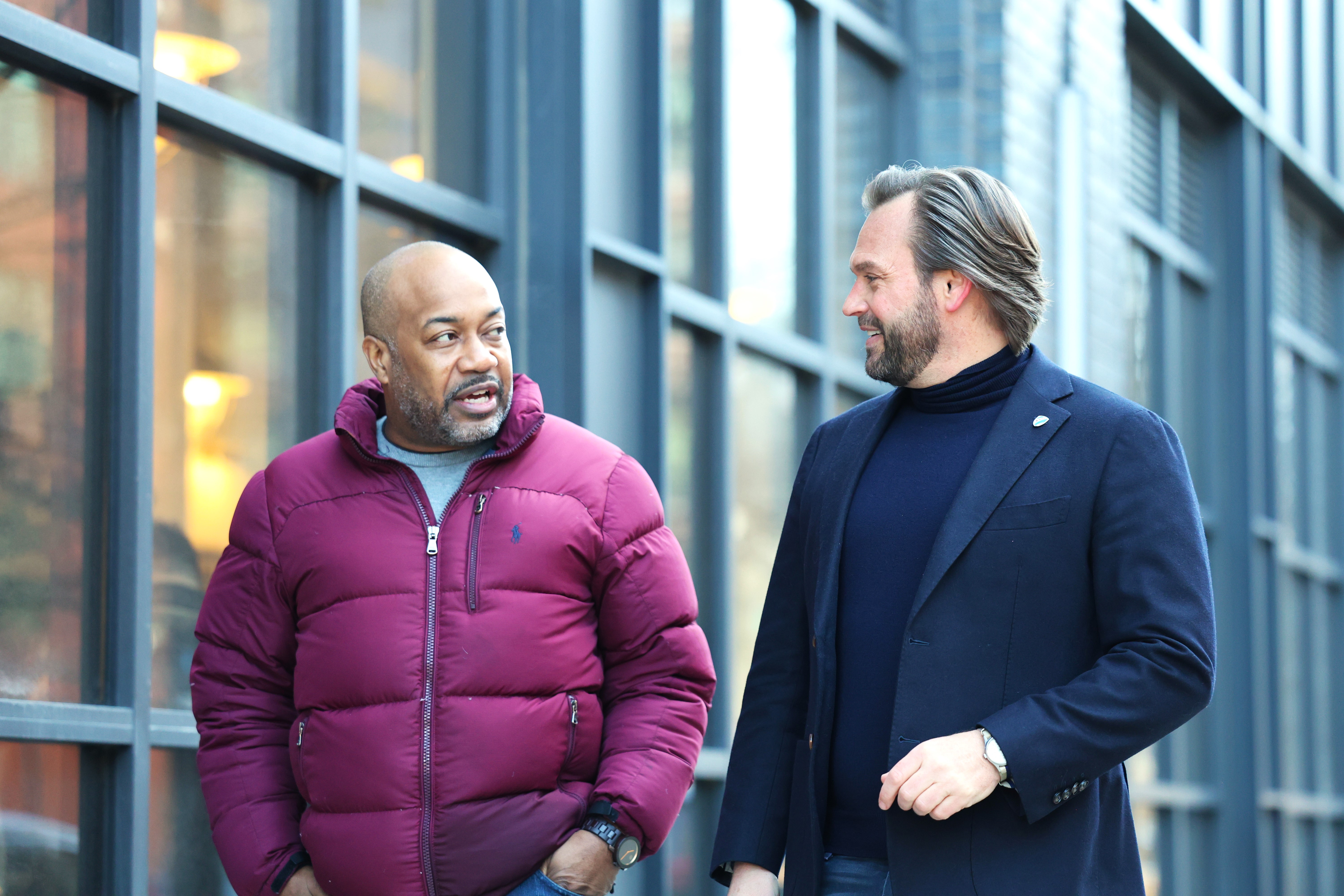 Dan Balanoff talking with a client outside a Chicago building