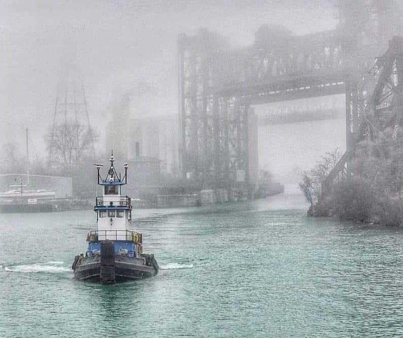 A tugboat on the Calumet River in the fog